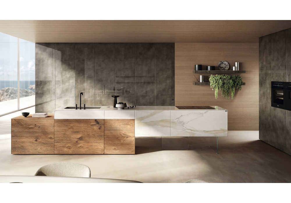 Open-concept kitchen with a two-tone island (wood base, white marble top), large windows with a seascape view on the left, and wall-mounted shelves with a plant on the right.