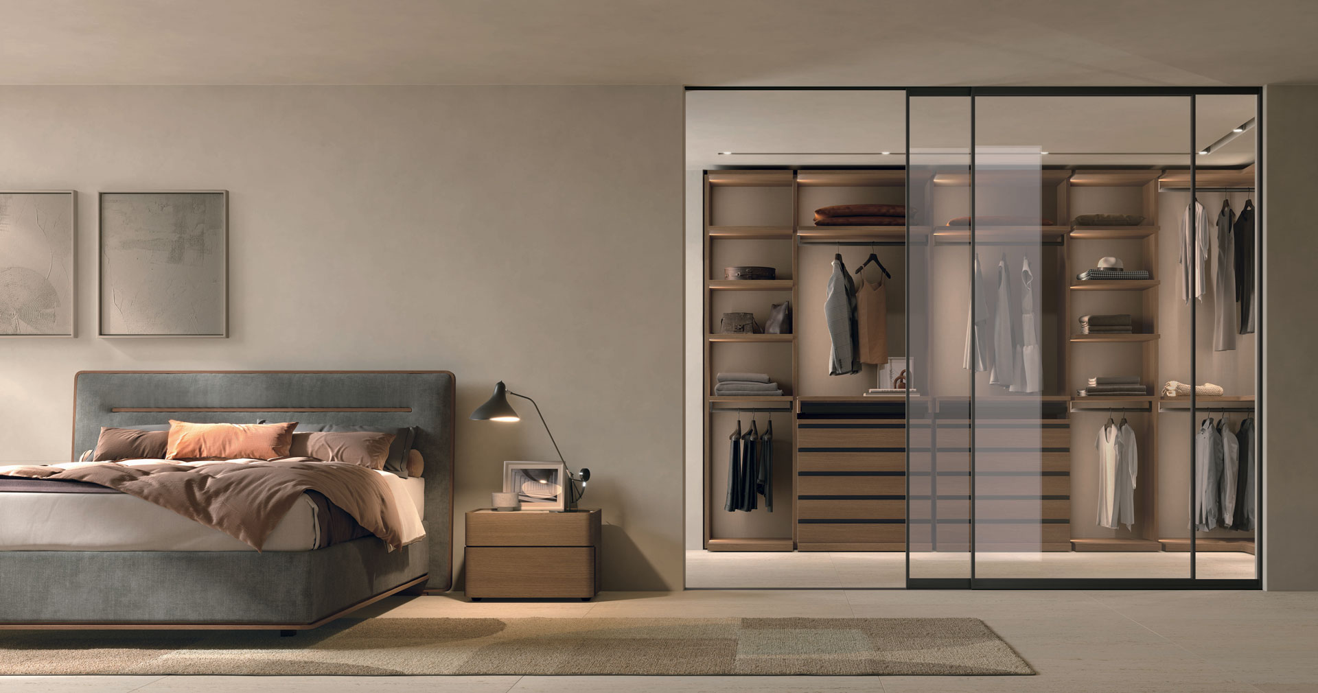 Modern bedroom with a glass-enclosed walk-in closet, pastel walls, and a gray upholstered bed with peach linens beside a wooden nightstand lamp.